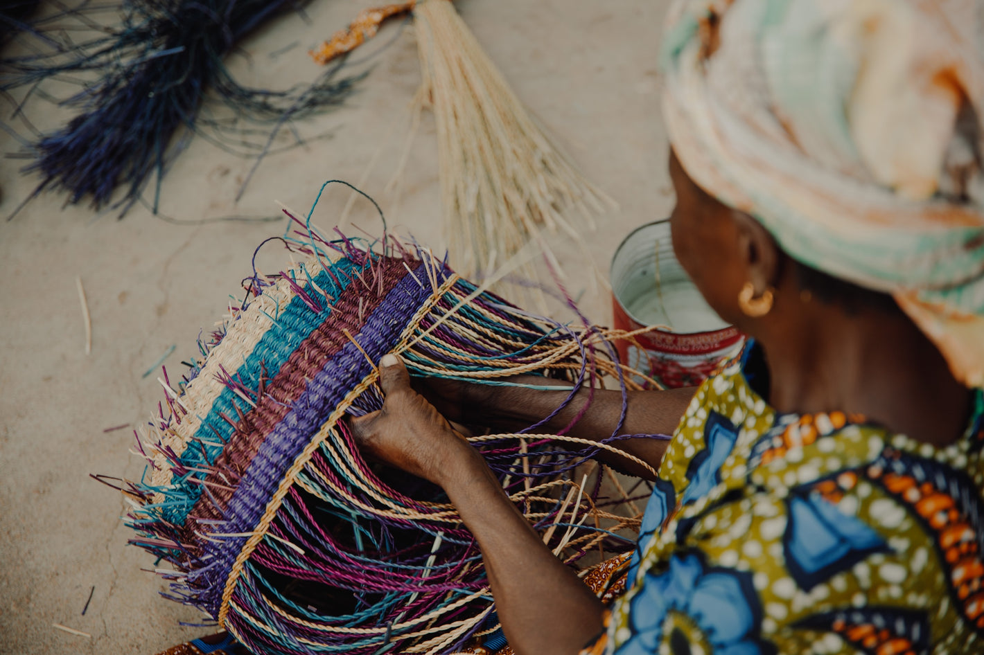 Woman from Ghana weaves Frafra basket