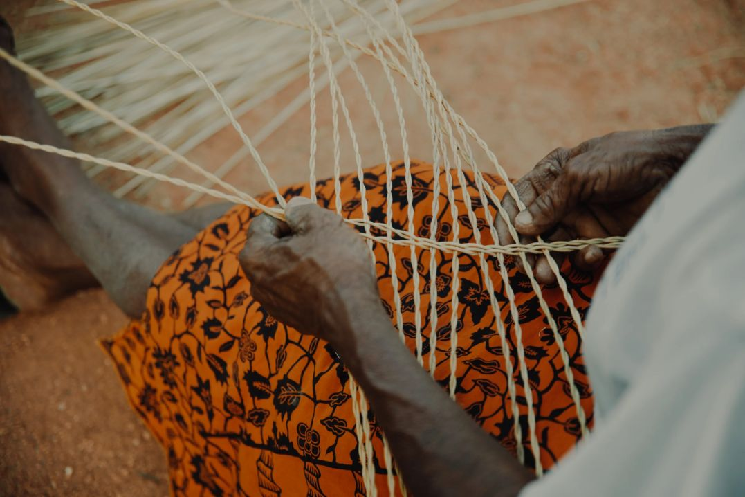  hands of a woman weaving basket from Veta Vera Grass